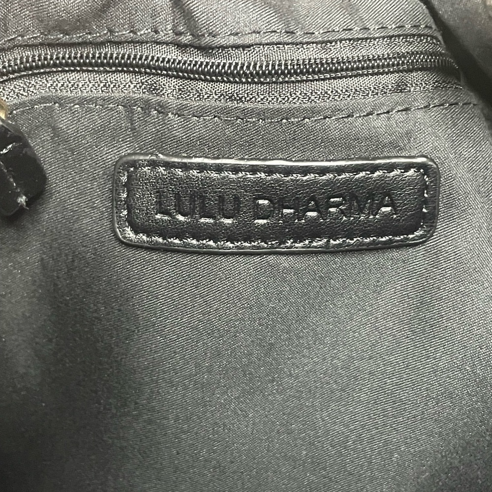 A black LULU Dharma tote bag.